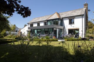 double-storey glass extension idea to detached house