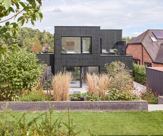 A self build home with two storeys and lawn in front