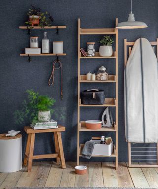 ladder shelf in utility room with blue walls