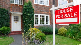 House prices sign outside of a brick house