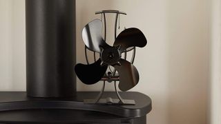 black stove fan on top of stove