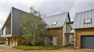 bungalow replacement contemporary design with upper storey glass link